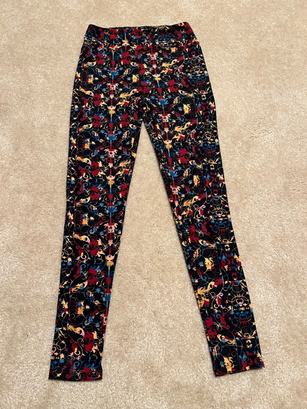 LuLaRoe Black Leggings with Red, Yellow and Blue Floral Scrolls